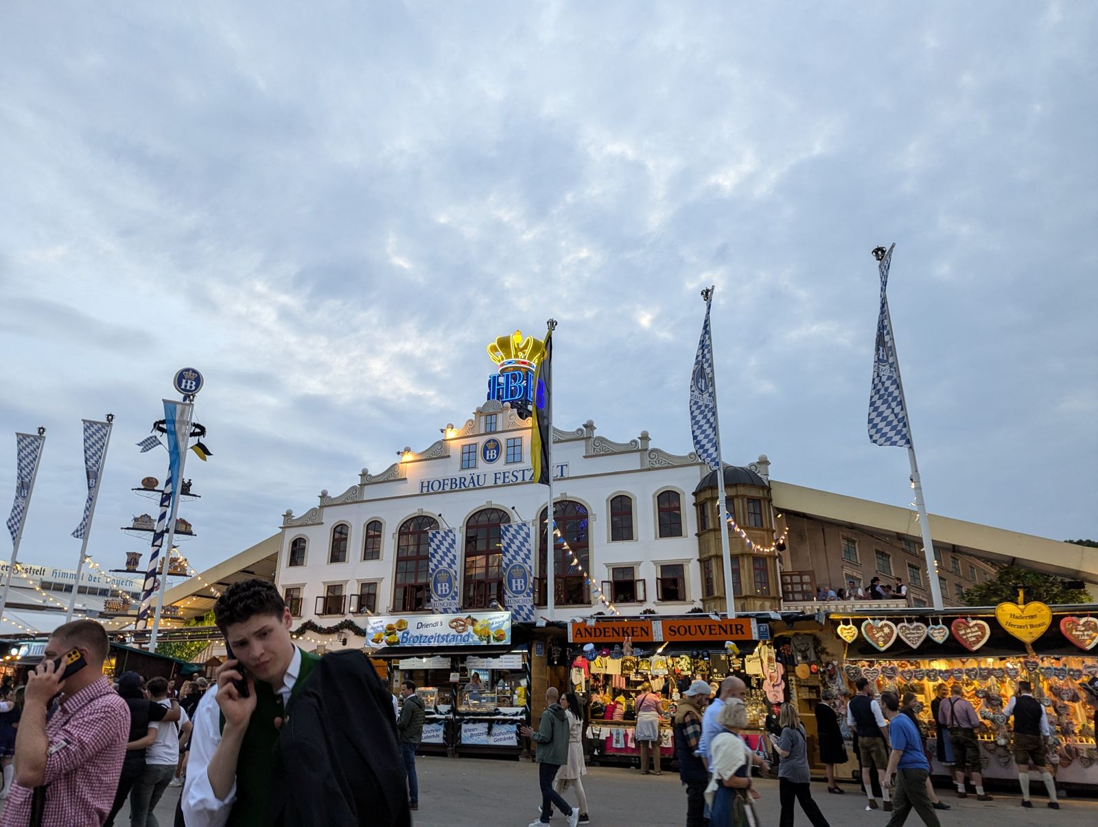 Hofbräu-Festzelt facade with its golden crown and souvenir stalls in front