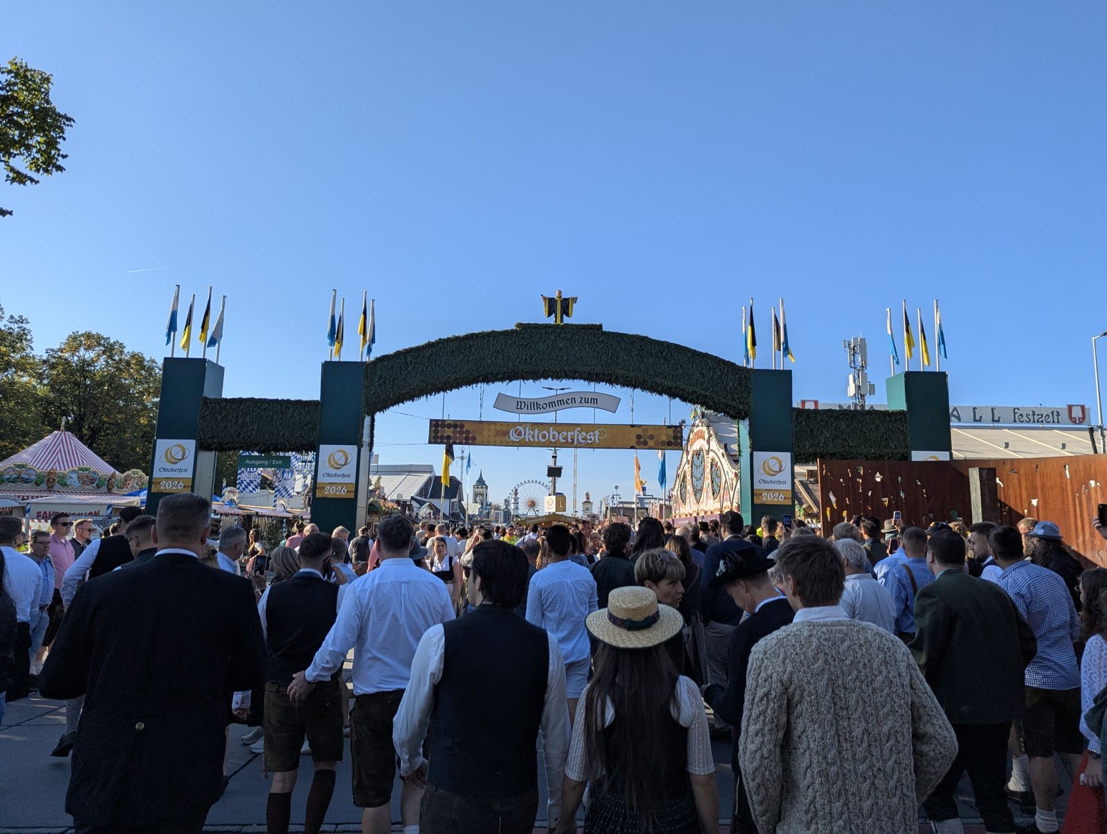 Crowds streaming through the main Oktoberfest entrance arch on opening morning