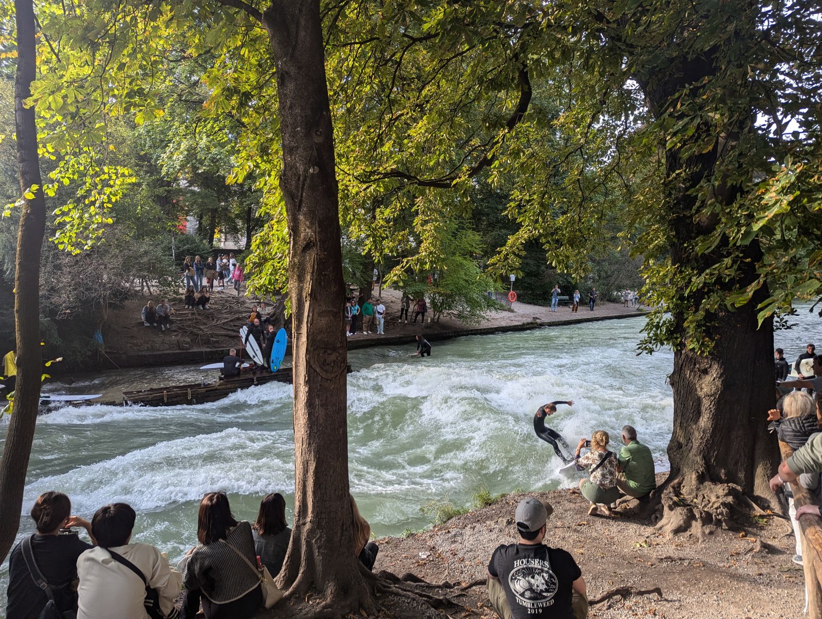 A surfer riding the standing wave on the Eisbach in Munich’s Englischer Garten